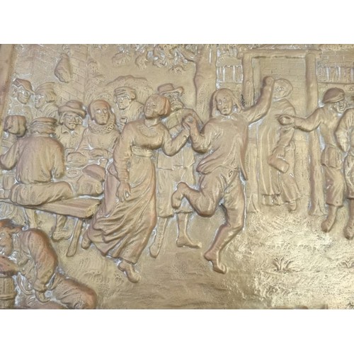 230 - Garden and Architectural Salvage: a large embossed brass plaque  of a country scene depicting figure... 