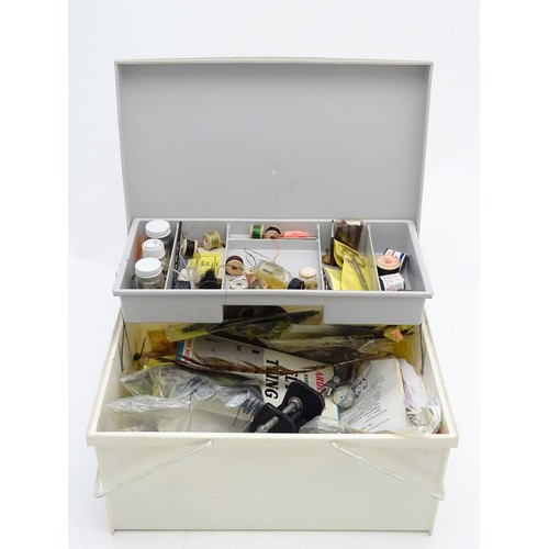 239 - Fishing / Fly Tying : An equipment box containing a quantity of fly fisherman's items to include a f... 