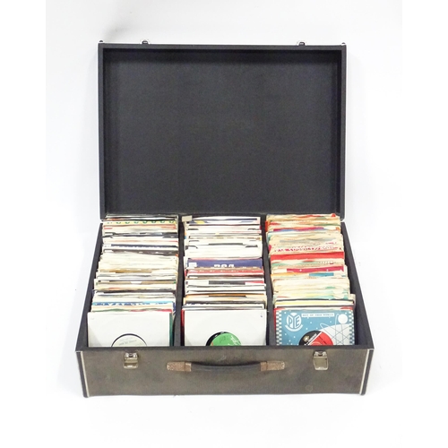 260 - A mid to late 20thC record / vinyl transit case containing a quantity of 1960's / 1970's / 1980's 45... 