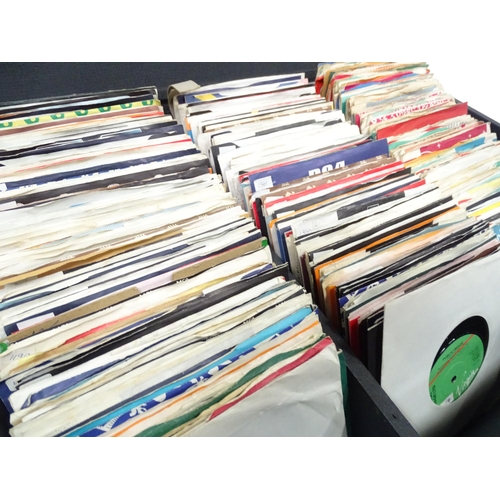 260 - A mid to late 20thC record / vinyl transit case containing a quantity of 1960's / 1970's / 1980's 45... 