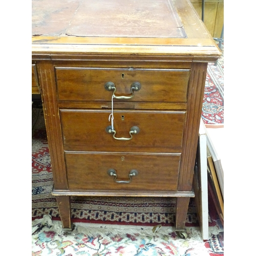 263 - Large early 20thC mahogany desk with leather insert to top and  standing on 8 legs with brass caster... 