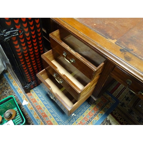 263 - Large early 20thC mahogany desk with leather insert to top and  standing on 8 legs with brass caster... 