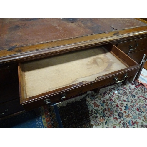 263 - Large early 20thC mahogany desk with leather insert to top and  standing on 8 legs with brass caster... 