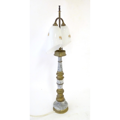 290 - A mid 20thC table lamp, the column consisting of alternating brass and onyx sections supporting a  d... 