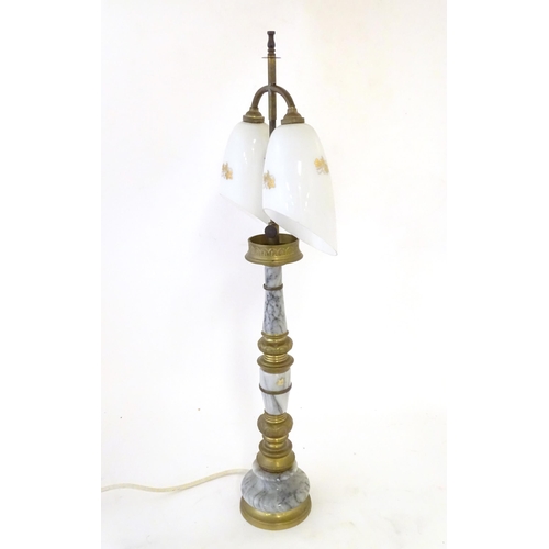 290 - A mid 20thC table lamp, the column consisting of alternating brass and onyx sections supporting a  d... 