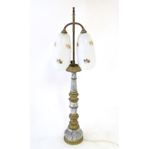 290 - A mid 20thC table lamp, the column consisting of alternating brass and onyx sections supporting a  d... 