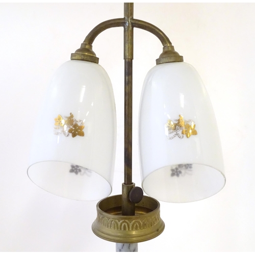 290 - A mid 20thC table lamp, the column consisting of alternating brass and onyx sections supporting a  d... 