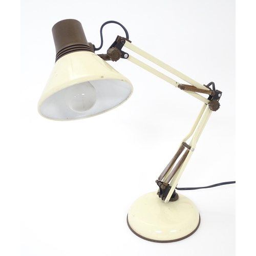 292 - An adjustable desk lamp in cream and brown livery in the Anglepoise style, marked under Patent Pendi... 