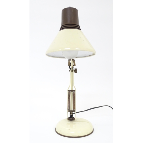 292 - An adjustable desk lamp in cream and brown livery in the Anglepoise style, marked under Patent Pendi... 