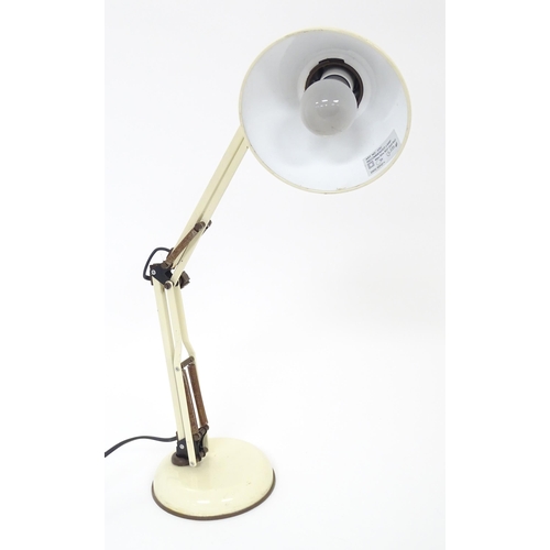 292 - An adjustable desk lamp in cream and brown livery in the Anglepoise style, marked under Patent Pendi... 