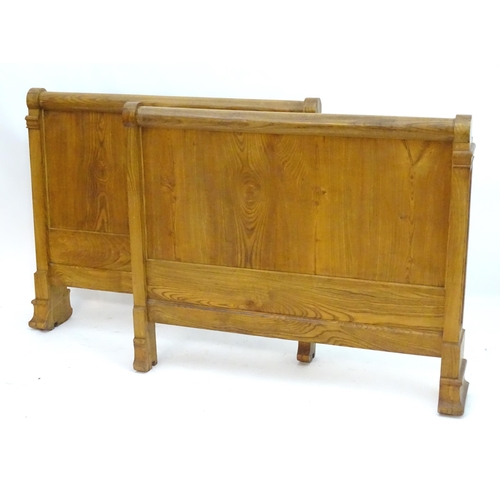 339 - A late 19thC / early 20thC elm sleigh bed. 48