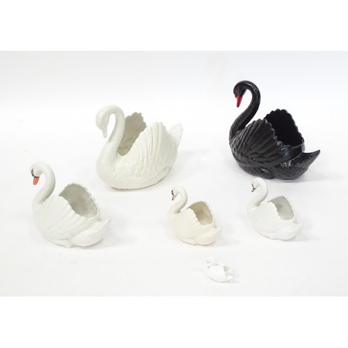 353 - Five planters / pots modelled as swans, by Dartmouth pottery Devon. Together with a model of a swan.... 