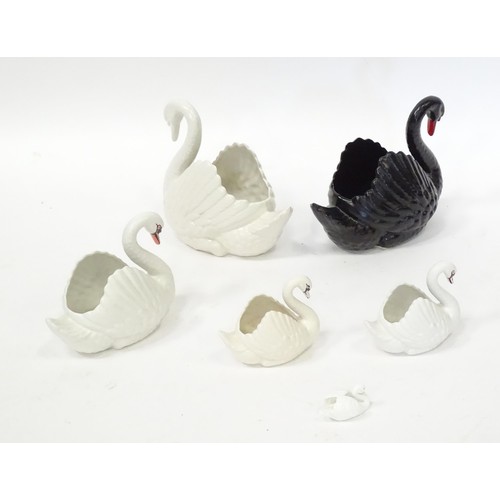 353 - Five planters / pots modelled as swans, by Dartmouth pottery Devon. Together with a model of a swan.... 
