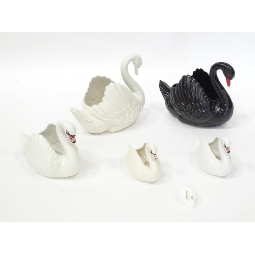 353 - Five planters / pots modelled as swans, by Dartmouth pottery Devon. Together with a model of a swan.... 