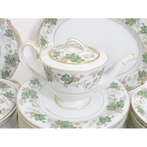 357 - A quantity of Noritake dinner wares in the pattern Daphne, to include serving dishes, plates, lidded... 