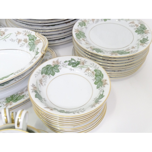 357 - A quantity of Noritake dinner wares in the pattern Daphne, to include serving dishes, plates, lidded... 