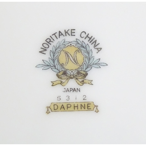 357 - A quantity of Noritake dinner wares in the pattern Daphne, to include serving dishes, plates, lidded... 