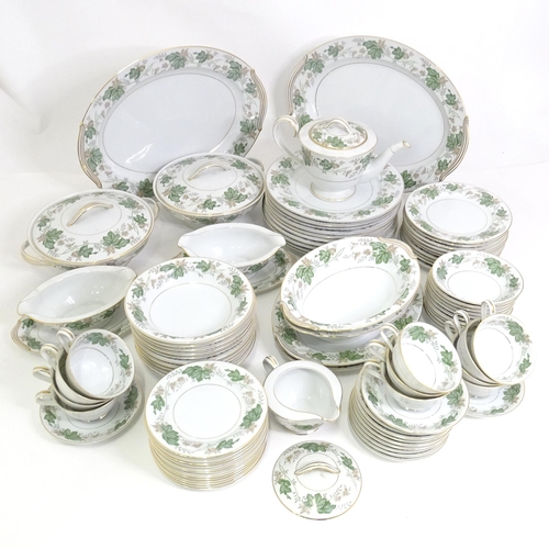 357 - A quantity of Noritake dinner wares in the pattern Daphne, to include serving dishes, plates, lidded... 