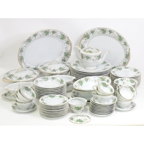 357 - A quantity of Noritake dinner wares in the pattern Daphne, to include serving dishes, plates, lidded... 