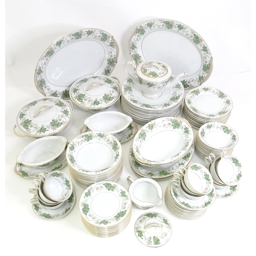 357 - A quantity of Noritake dinner wares in the pattern Daphne, to include serving dishes, plates, lidded... 