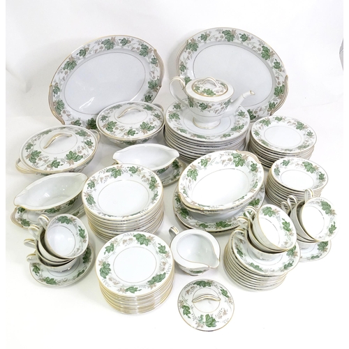 357 - A quantity of Noritake dinner wares in the pattern Daphne, to include serving dishes, plates, lidded... 
