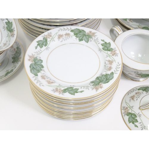 357 - A quantity of Noritake dinner wares in the pattern Daphne, to include serving dishes, plates, lidded... 