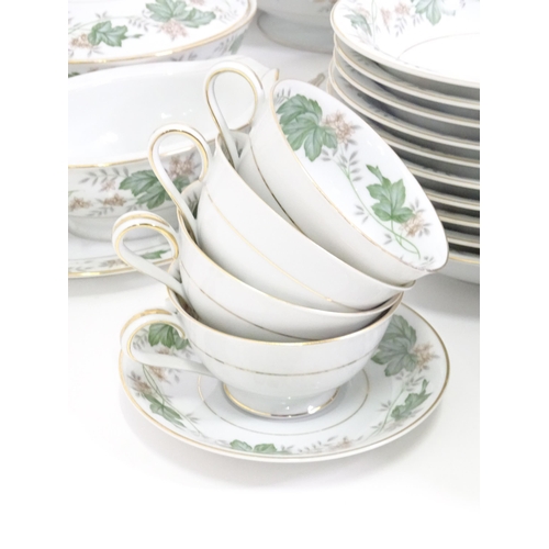357 - A quantity of Noritake dinner wares in the pattern Daphne, to include serving dishes, plates, lidded... 