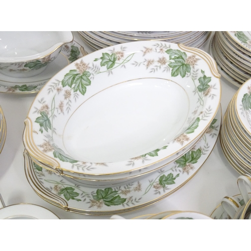 357 - A quantity of Noritake dinner wares in the pattern Daphne, to include serving dishes, plates, lidded... 