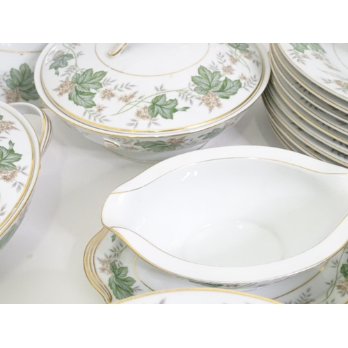 357 - A quantity of Noritake dinner wares in the pattern Daphne, to include serving dishes, plates, lidded... 