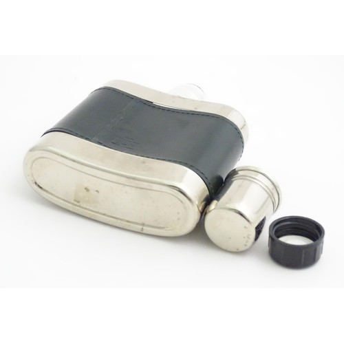 389 - A Longines pocket watch. Together with a hip flask (2)