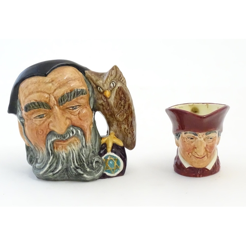 396 - A Royal Doulton small character jug modelled as Merlin, marked under D6536. Together with model of a... 