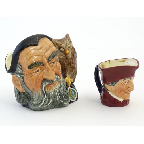 396 - A Royal Doulton small character jug modelled as Merlin, marked under D6536. Together with model of a... 