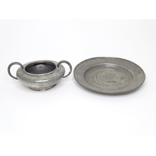 399 - Two items of Arts & Crafts style pewter wares with hammered decoration to include a twin handled sug... 