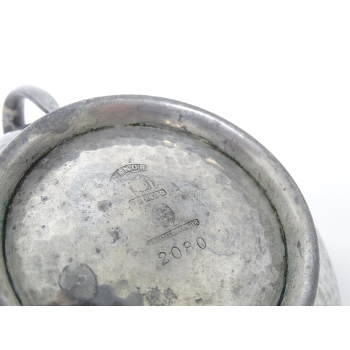 399 - Two items of Arts & Crafts style pewter wares with hammered decoration to include a twin handled sug... 