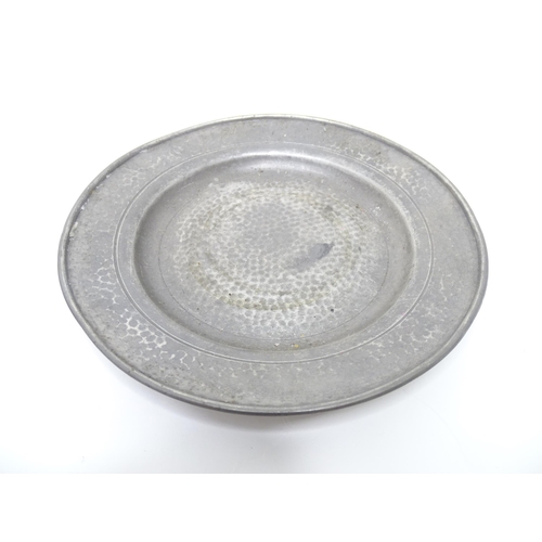 399 - Two items of Arts & Crafts style pewter wares with hammered decoration to include a twin handled sug... 