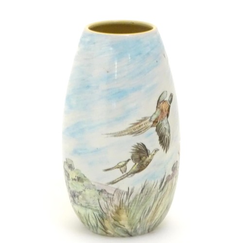 403 - A Branksome vase of ovoid form with hand painted decoration depicting a landscape scene with a stag ... 
