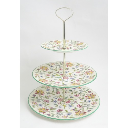 404 - A Minton three tier cake stand in the Haddon Hall pattern. Approx. 13 1/2