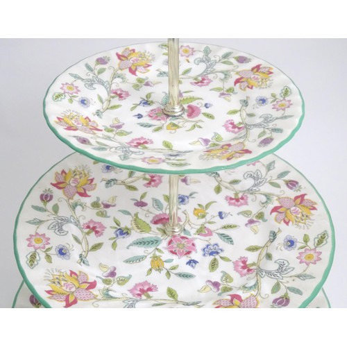 404 - A Minton three tier cake stand in the Haddon Hall pattern. Approx. 13 1/2