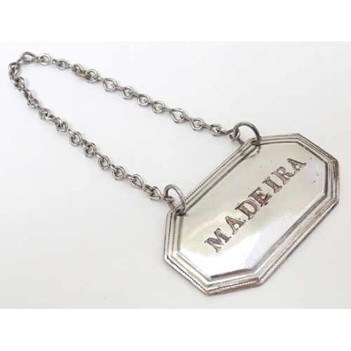 416 - A 19thC Old Sheffield plate wine / decanter label / bottle ticket, 'Madeira'. Approx. 1 3/4