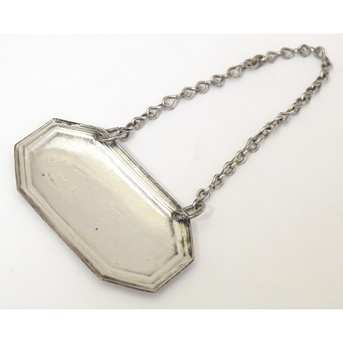 416 - A 19thC Old Sheffield plate wine / decanter label / bottle ticket, 'Madeira'. Approx. 1 3/4