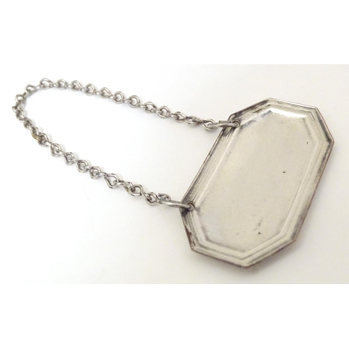 416 - A 19thC Old Sheffield plate wine / decanter label / bottle ticket, 'Madeira'. Approx. 1 3/4