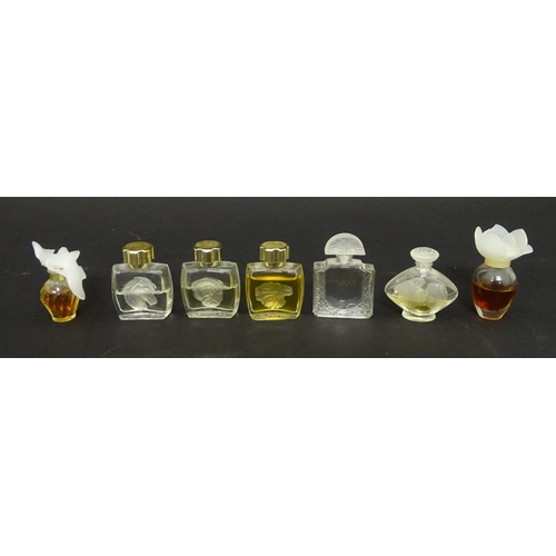 463 - A quantity of assorted miniature glass scent / perfume bottles, by Lalique, etc. (7)