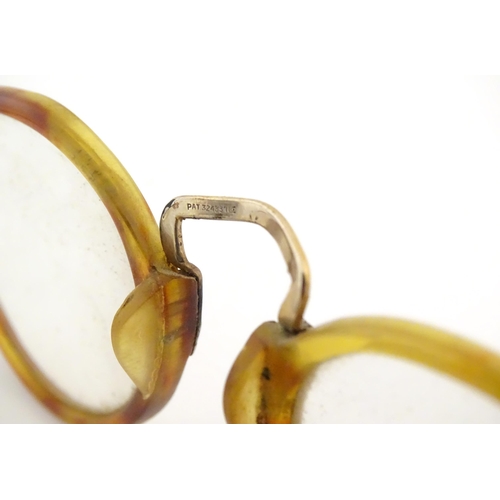 464 - A cased pair of c1940s bifocal spectacles / glasses, with faux tortoiseshell and gilt metal frames, ... 