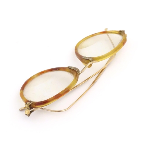 464 - A cased pair of c1940s bifocal spectacles / glasses, with faux tortoiseshell and gilt metal frames, ... 