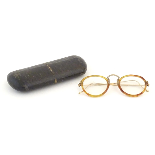 464 - A cased pair of c1940s bifocal spectacles / glasses, with faux tortoiseshell and gilt metal frames, ... 