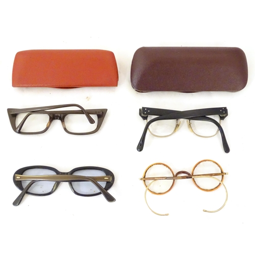 466 - Four pairs of mid 20thC spectacles / glasses, the largest 5 1/4