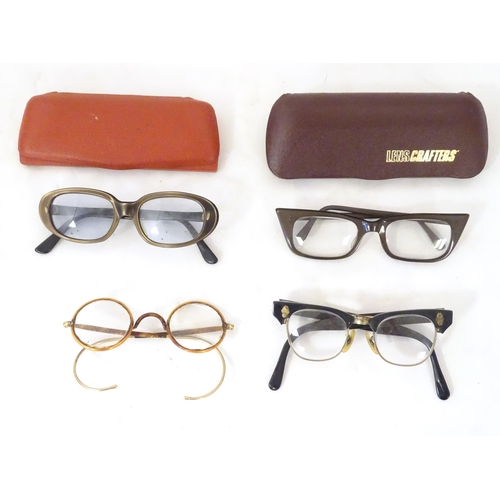 466 - Four pairs of mid 20thC spectacles / glasses, the largest 5 1/4