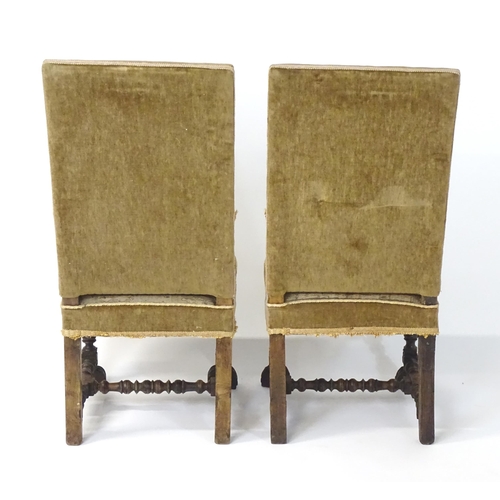 593 - A pair of late 19thC side chairs with rectangular backrests above sprung seats and carved oak legs w... 