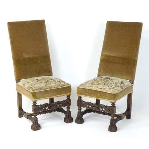 593 - A pair of late 19thC side chairs with rectangular backrests above sprung seats and carved oak legs w... 