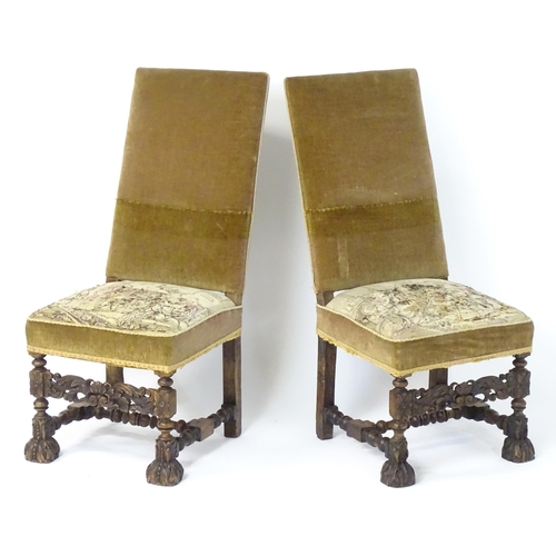 593 - A pair of late 19thC side chairs with rectangular backrests above sprung seats and carved oak legs w... 